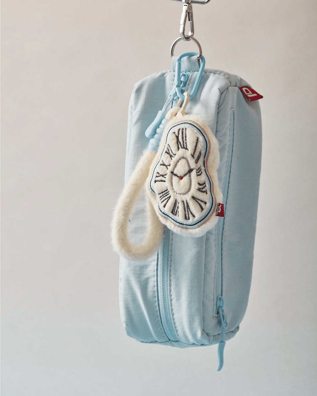 Melting Time plush keychain bag charm cream white baby blue Dalí inspired Hello Pepper