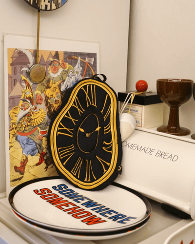 Black gold Roman numeral melting clock hand towel Persistence of Memory Dalí inspired